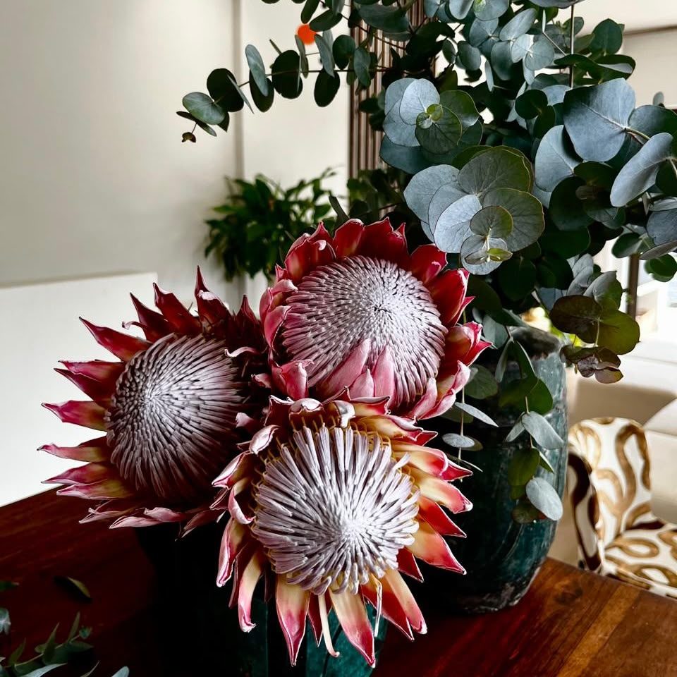 Sculptural arrangement of king protea and eucalyptus by Veld Studio